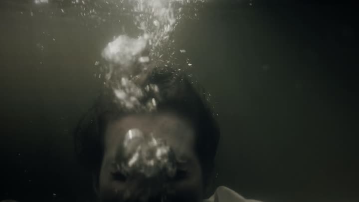 Bubbles going back into her mouth underwater